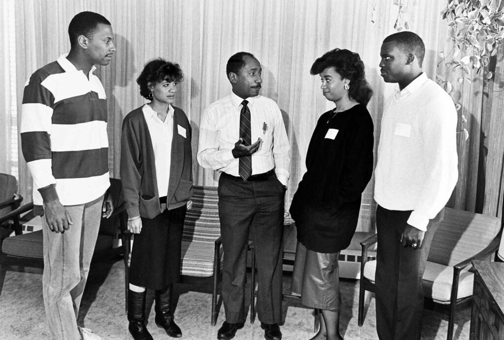 Robert Lee, PhD, speaks with four recently accepted medical students, 1988.